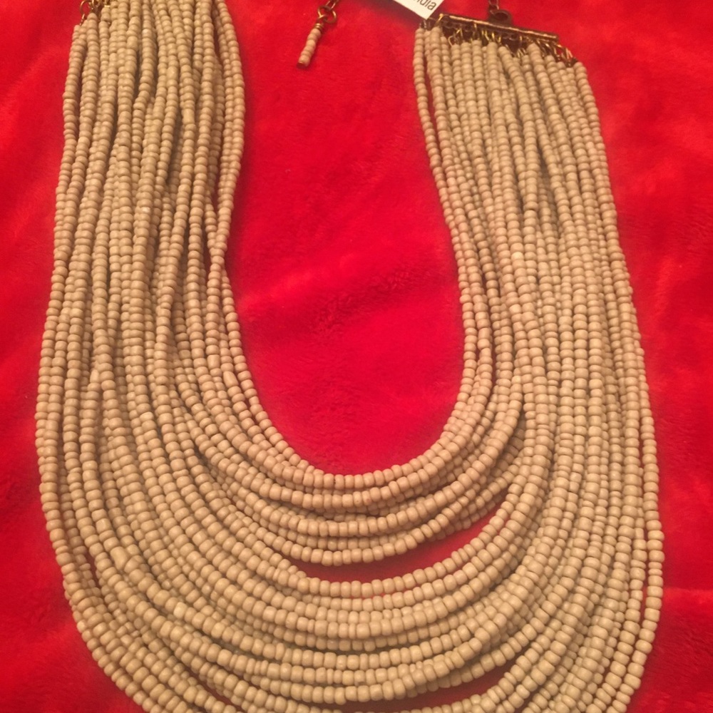 Tan seed beaded necklace.